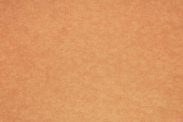 orange textured paper  background,  light brown  pasteboard surface