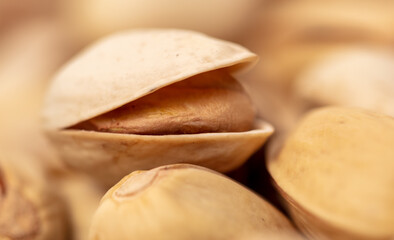 Close-up of fresh pistachio nuts as background.