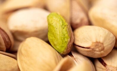 Close-up of fresh pistachio nuts as background.