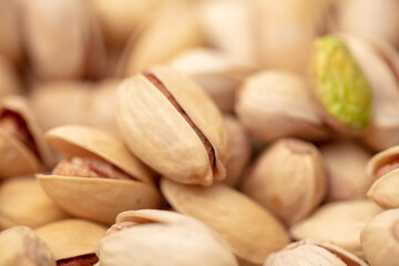 Close-up of fresh pistachio nuts as background.