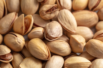 Close-up of fresh pistachio nuts as background.