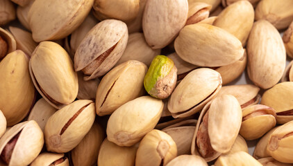 Close-up of fresh pistachio nuts as background.