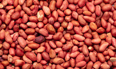 Close up of peanut nuts as background. Macro