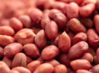 Close up of peanut nuts as background. Macro