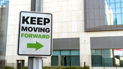 Keep moving forward sign in a downtown city setting