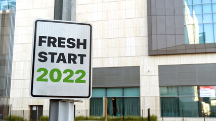Fresh start 2022 sign in a downtown city setting
