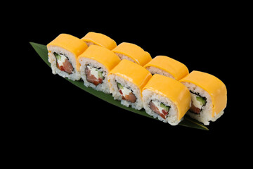 Rolls with salmon, chedar cheese, cream cheese, nori, cucumber and bell pepper, over black background with copy space.