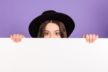 Photo of nice optimistic brunette hairdo girl hide wear black cap isolated on lilac color background