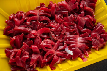 A box of fresh cut chicken kidney flowers
