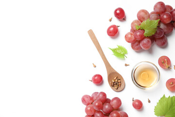 Composition with bowl of natural grape seed oil on white background, top view. Organic cosmetic