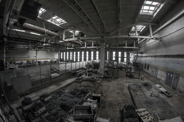 Gloomy dark large workshop of an old abandoned metal processing plant