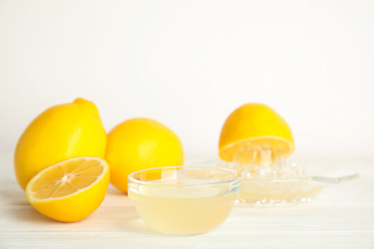 Freshly squeezed lemon juice on white table