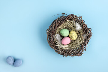 Closeup of easter egg nest flatlay. Minimal holiday season concept background. Copy space for text