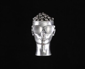silver mannequin head isolated on black background