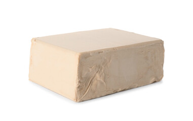 Block of compressed yeast on white background