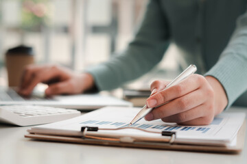 Business people working with graphs, business documents on their desks to analyze for business startups.