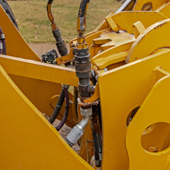 Hydraulic system with actuators and valves on earth moving equipment; hydraulic lines