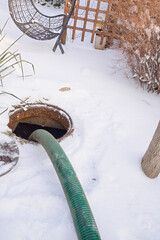 pumping septic tanks from the backyard tank in the countryside