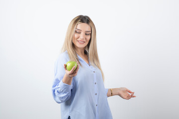 Portrait photo of a pretty attractive woman model standing and holding