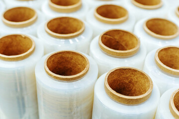 Stretch film in rolls. Production and sale of packaging made of polymeric material. Lots of objects. Close-up