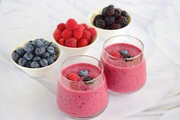 Healthy berry smoothie made from raspberry, blackberry, blueberry, coconut yogurt and almond milk