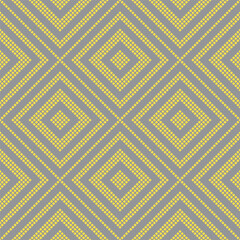 Colors of year 2021 illuminating yellow and ultimate gray geometric seamless rhombus pattern. Abstract diamond vector pattern of squares. Simple vector illustration. Geometric design for web and print