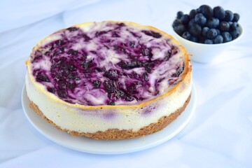 Blueberry cheesecake on white background