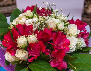 Bouquet of red Alstroemeria and white Roses close up