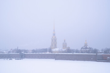 Peter and Paul Fortress in the fog in winter. St. Petersburg