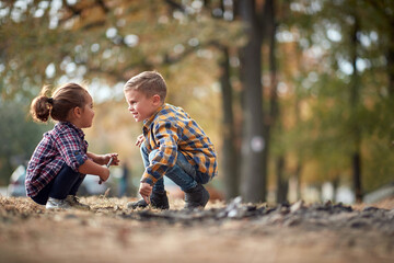 Male and female child having fun outdoor