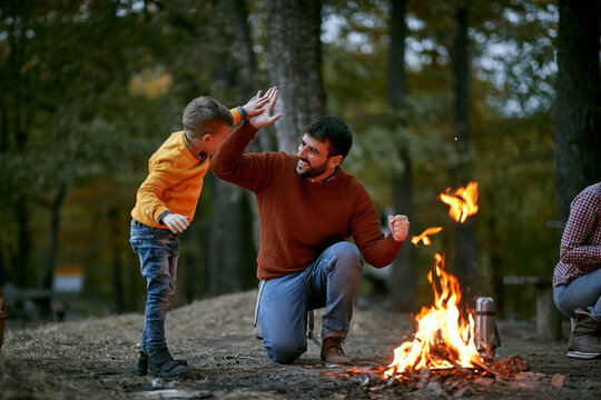 Father with son giving five