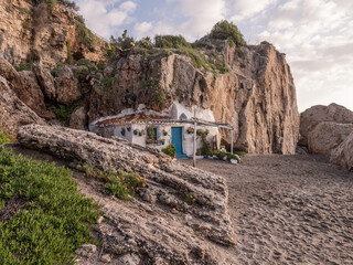 old fisherman's hut with blue door at the beach at the Playa de la Calahonda in nerja, spain