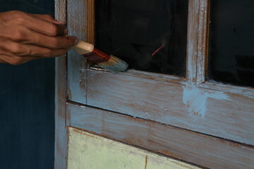 worker painting a wall