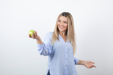 Portrait photo of a pretty attractive woman model standing and holding