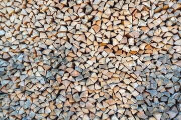 The pile of split birch firewood close-up