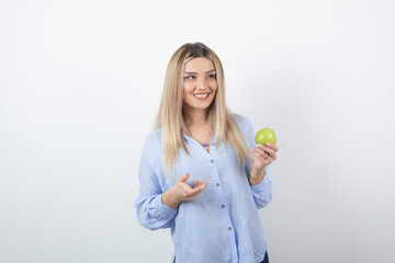 Portrait photo of a pretty attractive woman model standing and holding