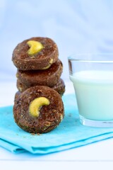 Chocolate cookies with cashew nuts. Served with glass of milk 
