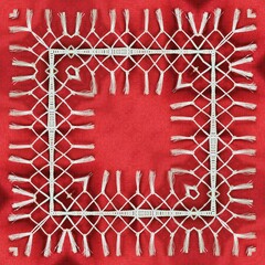 patterns and designs from traditional plain dark red material with white tassel fringe  in square format
