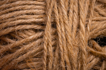 Close-up view of natural twine wound on a card. Craft background