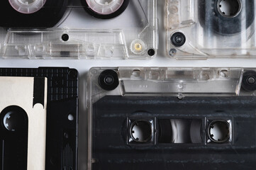Monochrome audio cassettes on a gray background. Vintage sound background