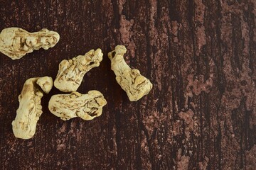 dang gui (angelica sinensis) with dang gui ginseng slice on wooden background, traditional Chinese...