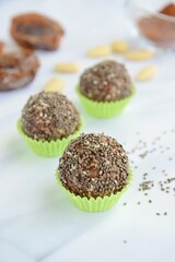 Chia seeds date almond cacao energy balls. Selective focus
