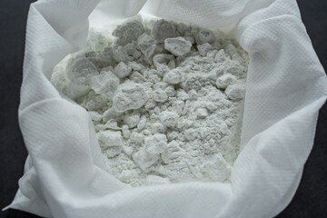 A bag of moisture-absorbing lime powder
