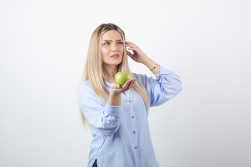 Portrait photo of a pretty attractive woman model standing and holding