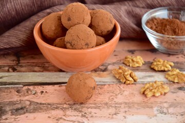 Homemade healthy vegan chocolate truffles with dates and walnuts