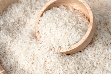 White rice in wooden bowl on rice background. (Rice Kor. 43)