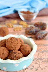 Homemade healthy vegan chocolate truffles with dates and walnuts