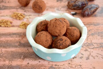 Homemade healthy vegan chocolate truffles with dates and walnuts