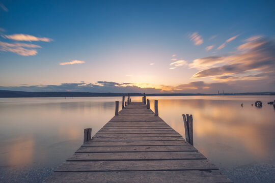 Old wooden dock at the lake, sunset shot © ValentinValkov