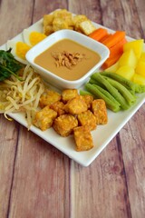 Traditional Indonesian Food, Gado-gado. Made from boiled vegetable, egg, tempeh and fried tofu served with peanut sauce